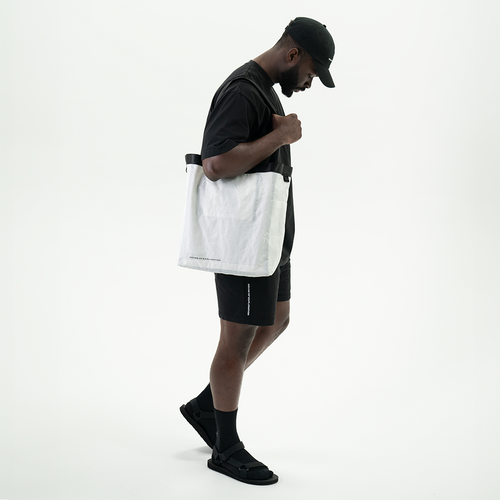 man-wearing-h-o-e-limited-edition-wandrd-tote-backpack