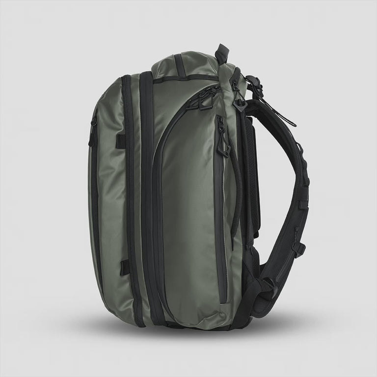 TRANSIT Travel Backpack Green Side Expansion Zipper opening and closing | variant_ids: 40190470750288, 40190470815824